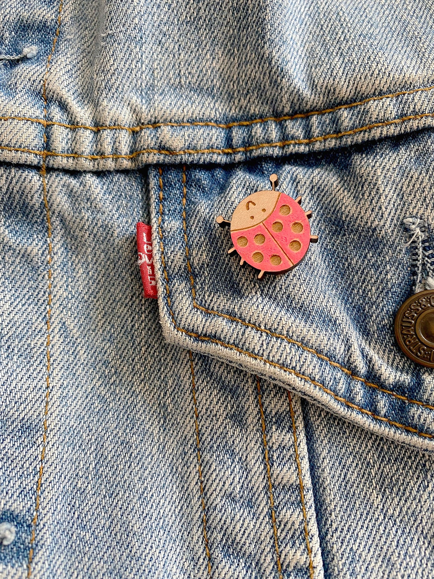 Hand-painted ladybird wooden pin badge